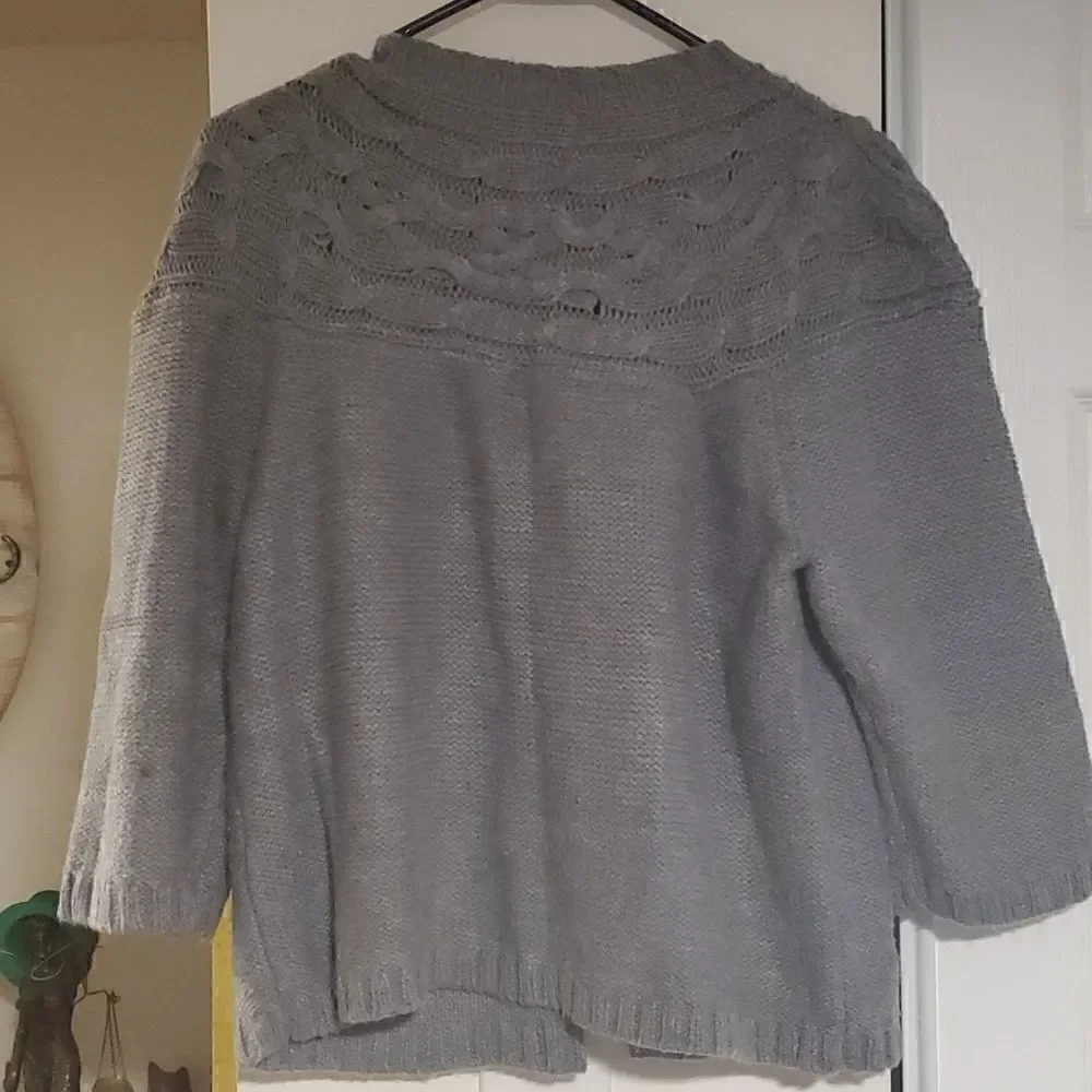 Three top button knit sweater